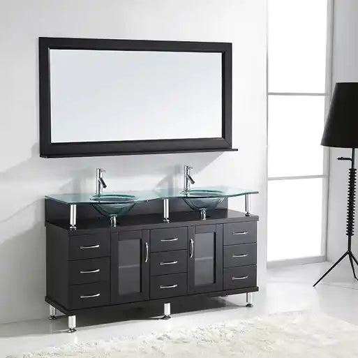 A black double vanity with glass vessel sinks, chrome faucets, and a matching mirror.