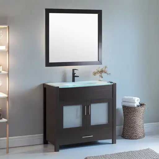 Dark brown vanity with a light blue glass basin and a black framed mirror.