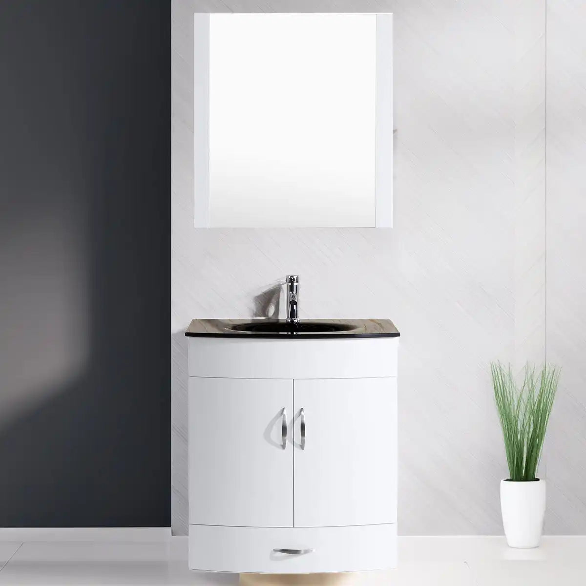 White bathroom vanity with a black countertop sink and an overhead mirror.